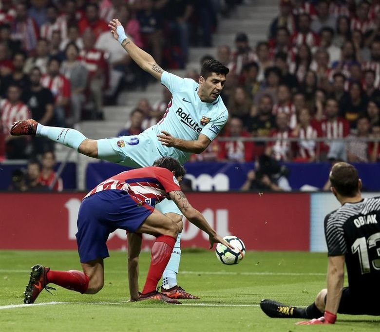 1-1. Atlético y Barcelona empatan con goles de Saúl y Luis Suárez
