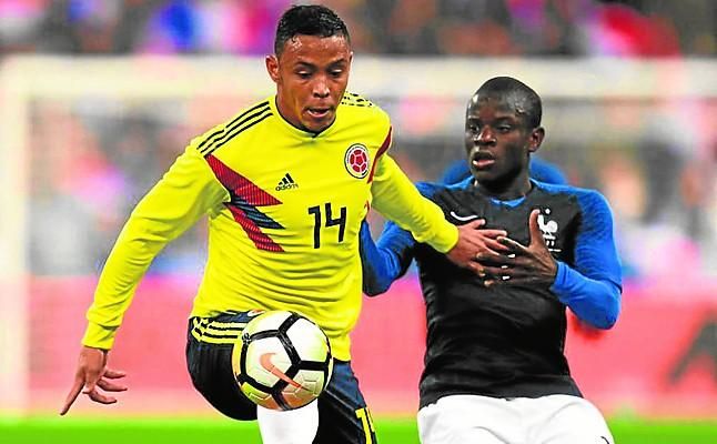 Muriel ve la botella medio llena