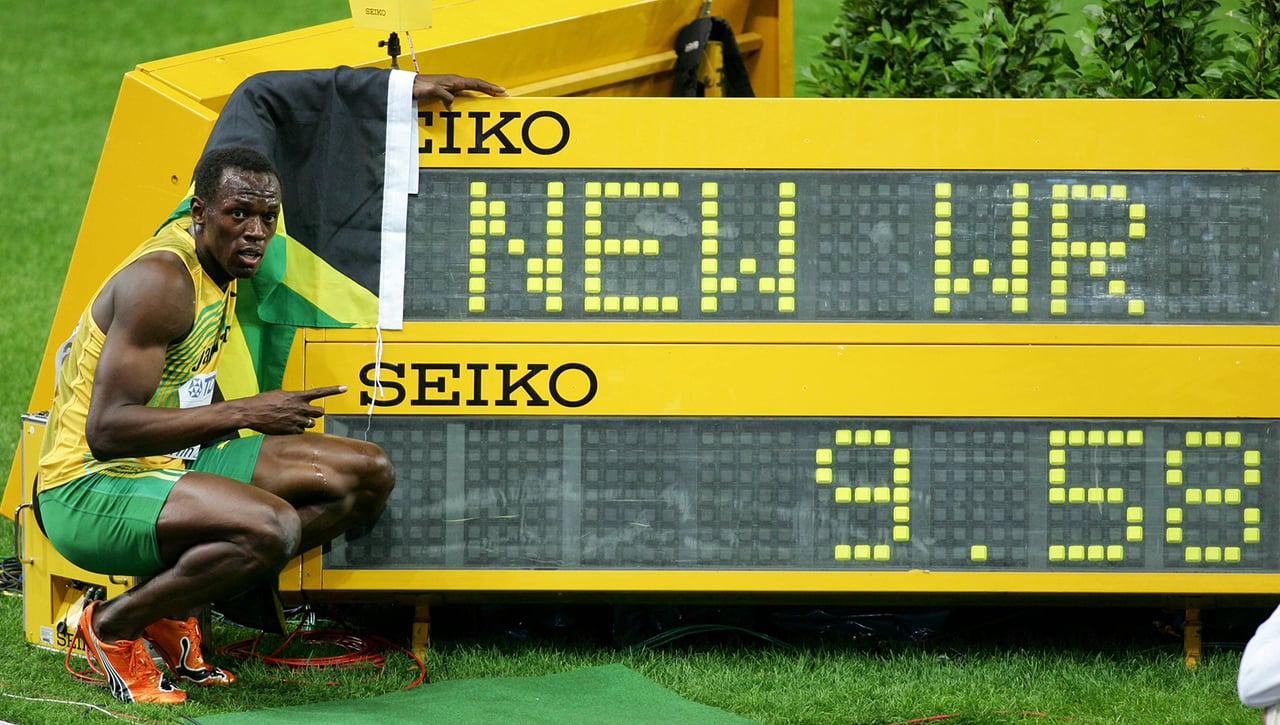 ¿Cuál es el récord de los 100 metros lisos y quién lo tiene?